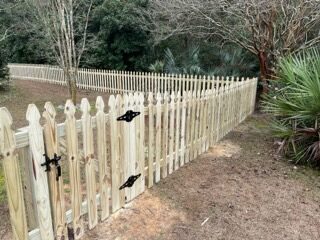 Wood picket fence with black hardware and gate